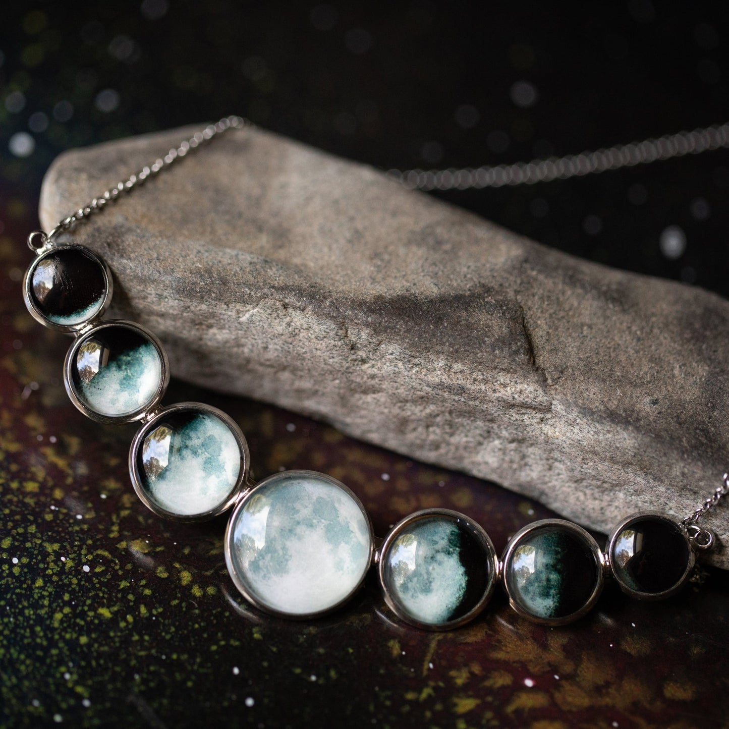 Varying Sized Curved Moon Phase Necklace in Silver