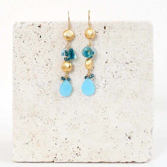 Blue Chalcedony & Aquamarine Gold Drop EarringsGorgeous gold drop earrings. Made with blue chalcedony, aqua blue quartz and aquamarine gemstones.- 2.5" long- French hooks- 14k gold plated .925 fine Italian sterliEarringsPARKEN JEWELRYVettedArcBlue Chalcedony & Aquamarine