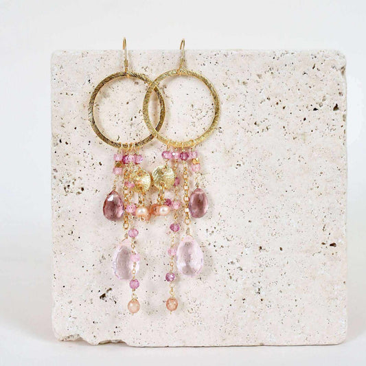 Rose Pink Gemstones Ammil EarringsMultiple strands of lush gems sparkle on a 1" hoop.
- Pink Clear Quartz and Pink Tourmaline gemstones- 3.5" long- French hooks- 14k gold plated .925 fine Italian steEarringsPARKEN JEWELRYVettedArcRose Pink Gemstones