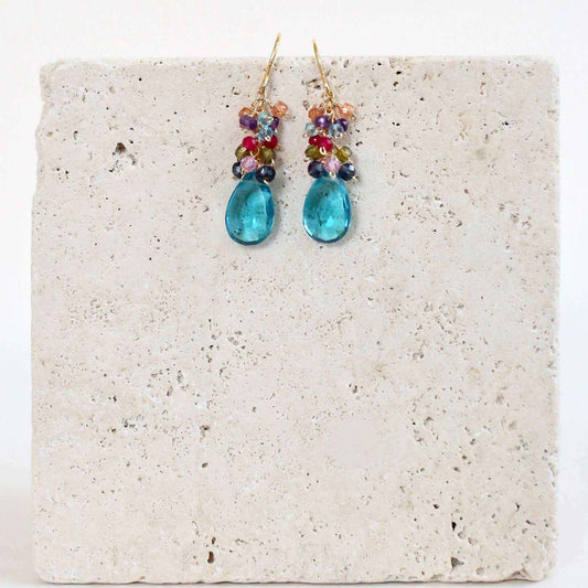 Neon Blue Quartz Bala EarringsStunning drops of color. Gold drop earrings made with neon blue quartz topped with a rainbow cluster of gems.
- 1.25" long- French hooks- 14k gold plated .925 fine IEarringsPARKEN JEWELRYVettedArcNeon Blue Quartz