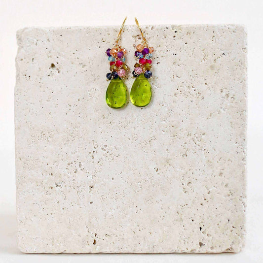 Peridot Quartz Bala EarringsStunning drops of color. Gold drop earrings made with peridot quartz topped with a rainbow cluster of gems.
- French hooks- 1.25" long- 14k gold plated .925 fine ItaEarringsPARKEN JEWELRYVettedArcPeridot Quartz