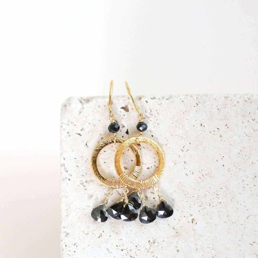 Black Spinel Mini Boho EarringsInspired by dream catchers, these boho minis are ready-to-wear with anything.
- Black Spinel gemstones- 1.5" long- French Hooks- 14k gold plated over .925 Italian fEarringsPARKEN JEWELRYVettedArcBlack Spinel Mini Boho Earrings