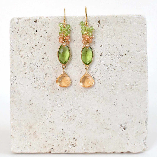 Citrine & Peridot Bezel Cluster EarringsDripping in gems, these long drop earrings are made with a peridot quartz bezel paired with citrine and peridot gemstones.- 2.5" long- French hooks- 14k gold plated EarringsPARKEN JEWELRYVettedArcCitrine & Peridot Bezel Cluster Earrings