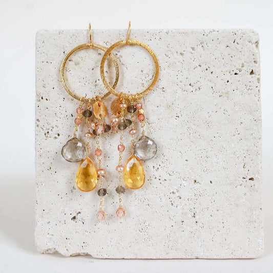 Citrine & Smoky Quartz Ammil EarringsMultiple strands of lush gems sparkle on a 1" hoop.
- Citrine and Smoky Quartz gemstones- 3.5" long- French hooks- 14k gold plated .925 fine Italian sterling silver-EarringsPARKEN JEWELRYVettedArcCitrine & Smoky Quartz Ammil Earrings