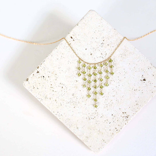 Peridot Mini Fringe NecklaceThese super delicate necklaces are our unique gemstone version of fringe jewelry.
- Peridot gemstones- 17-19" long with a 2" extender chain- Spring ring clasp- 14k gNecklacesPARKEN JEWELRYVettedArcPeridot Mini Fringe Necklace
