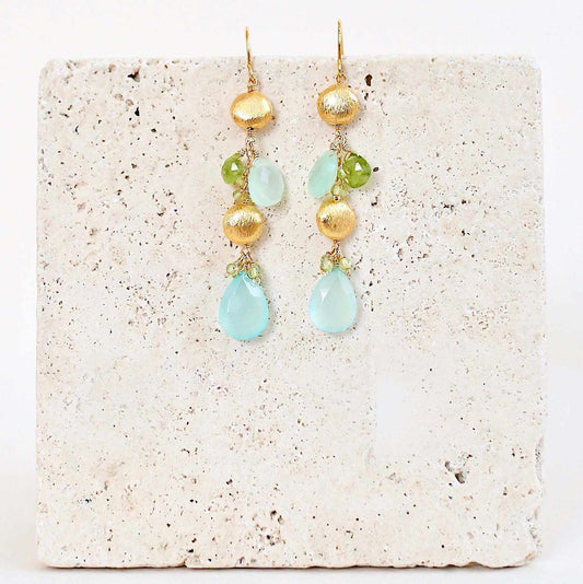 Aqua Chalcedony & Peridot Gold Drop EarringsGorgeous aqua chalcedony gemstone drop earrings. Made with aqua chalcedony and peridot gemstones.- 2.5" long- French hooks- 14k gold plated .925 fine Italian sterlinEarringsPARKEN JEWELRYVettedArcAqua Chalcedony & Peridot
