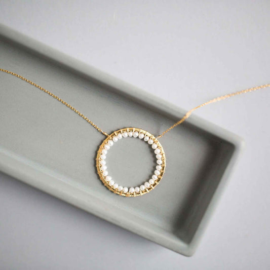 Pearl Halo Jewelry SetThe Halo collection was our very first one. Intended to symbolize the intricate, universal energy woven within us all. This beautiful set is ultra lightweight and peNecklace/Earring SetPARKEN JEWELRYVettedArcPearl Halo Jewelry Set