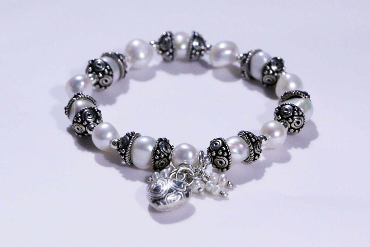 Elegant handcrafted jewelry collection including pendants, earrings, and bracelets