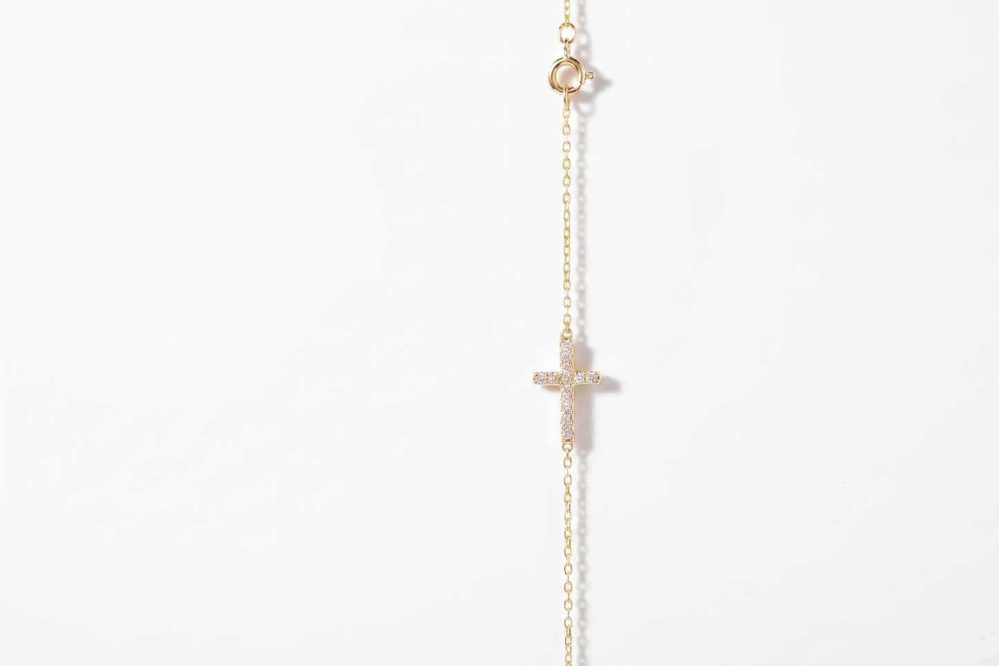 14K Gold Sideways Cross Necklace with Sparkling CZ Diamonds