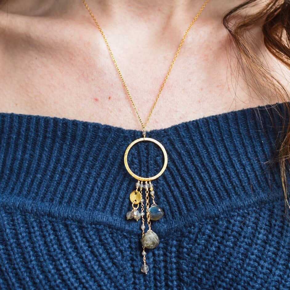 The Ammil Necklace featuring a lush labradorite pendant with multiple gemstone strands on a 14k gold plated hoop, handmade in NYC with tarnish-resistant sterling silver.