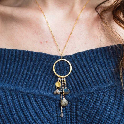 The Ammil Necklace featuring a lush labradorite pendant with multiple gemstone strands on a 14k gold plated hoop, handmade in NYC with tarnish-resistant sterling silver.