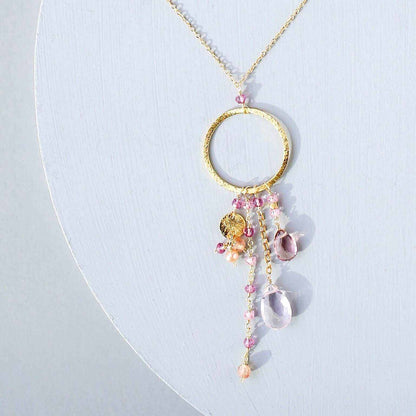 The Ammil Necklace with rose pink gemstones and gold hoop pendant