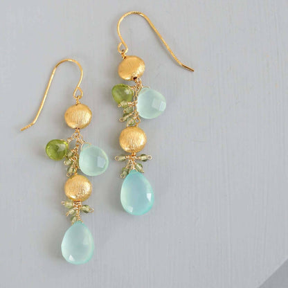 Aqua Chalcedony & Peridot Gold Drop EarringsGorgeous aqua chalcedony gemstone drop earrings. Made with aqua chalcedony and peridot gemstones.- 2.5" long- French hooks- 14k gold plated .925 fine Italian sterlinEarringsPARKEN JEWELRYVettedArcAqua Chalcedony & Peridot