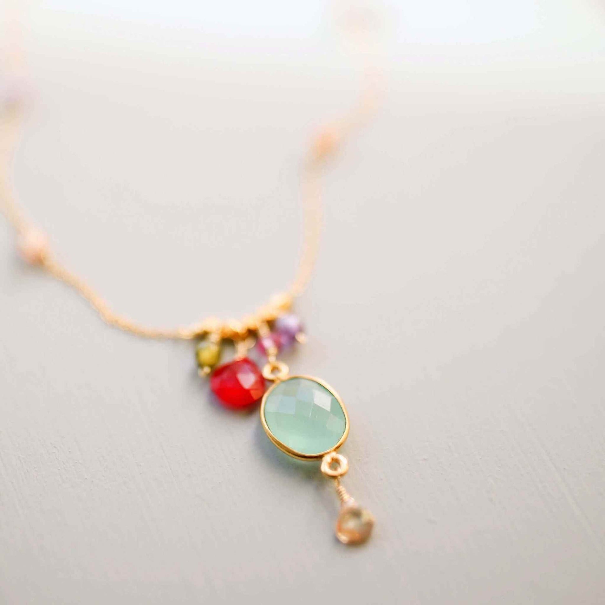Aqua chalcedony rainbow bezel necklace with gold chain and multicolored gemstone accents