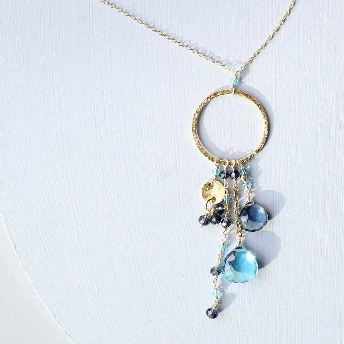 Aquamarine and iolite Ammil necklace with multistrand gemstones and gold hoop clasp