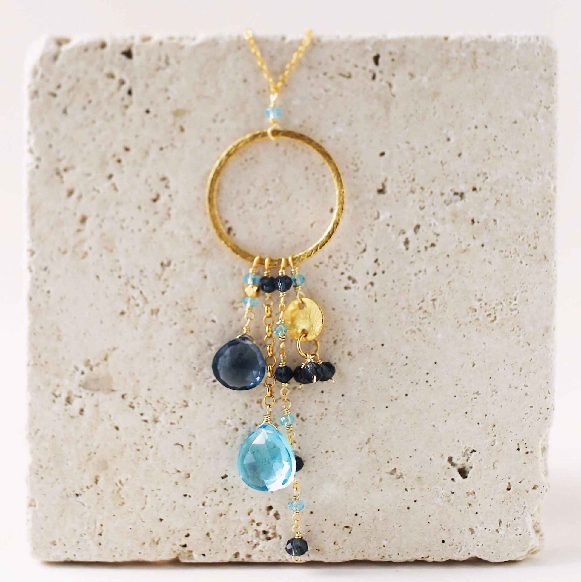Aquamarine and Iolite Ammil Necklace with gold hoop and multi-strand gemstone design