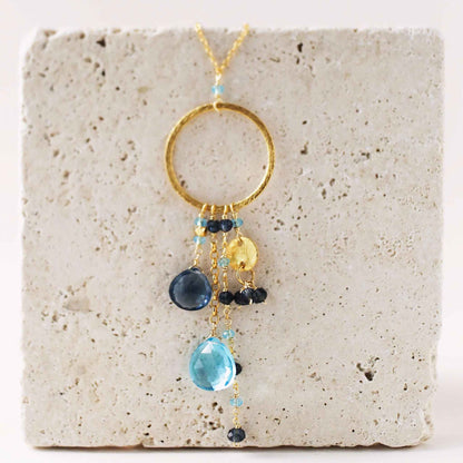 Aquamarine and Iolite Ammil Necklace with gold hoop and multi-strand gemstone design