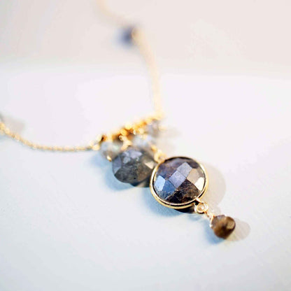 Gold bezel necklaces with gemstone pendants on delicate chains