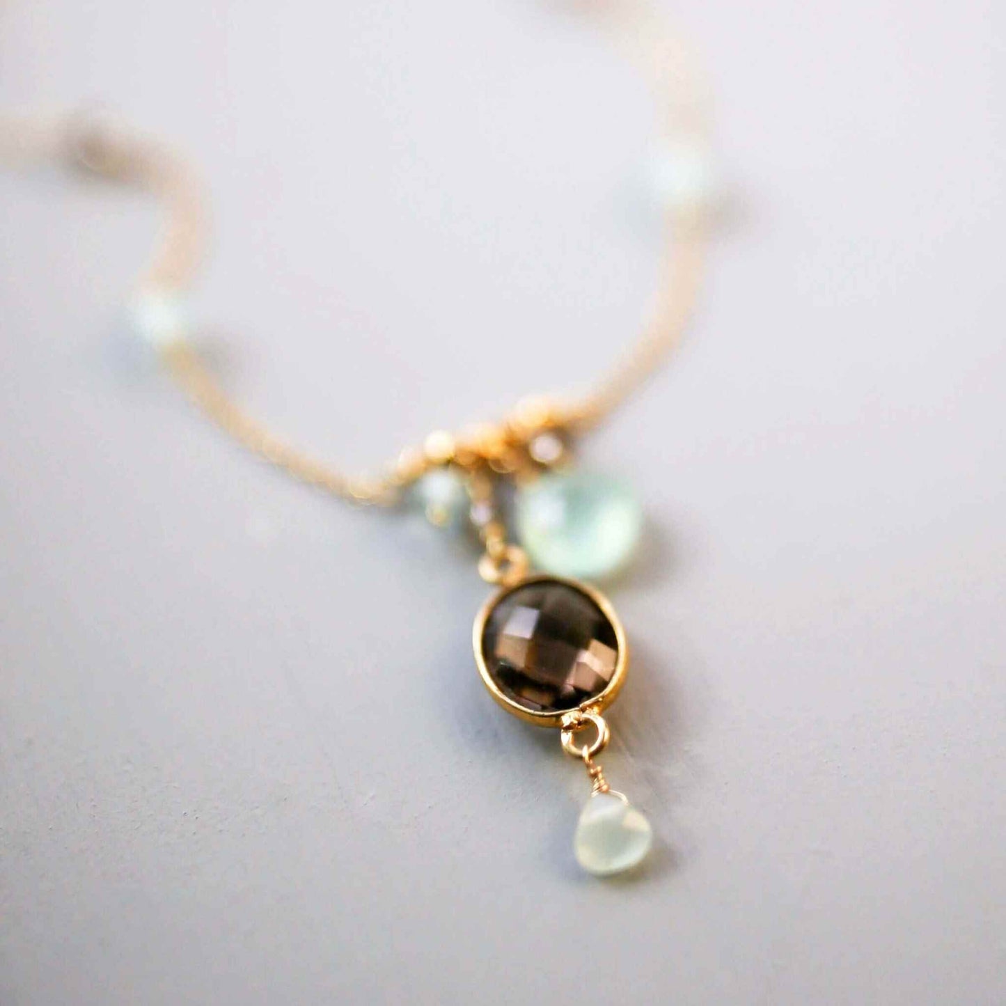 Bezel necklaces with 14k gold plated sterling silver and various bezel set gemstones on delicate gold chains