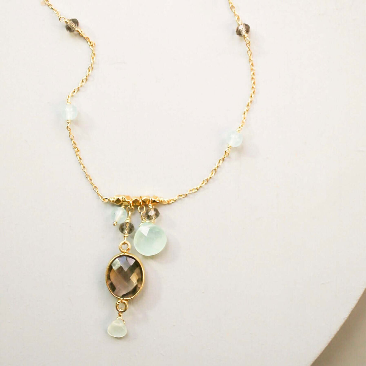 Elegant bezel necklaces with bezel set gemstones on gold chains