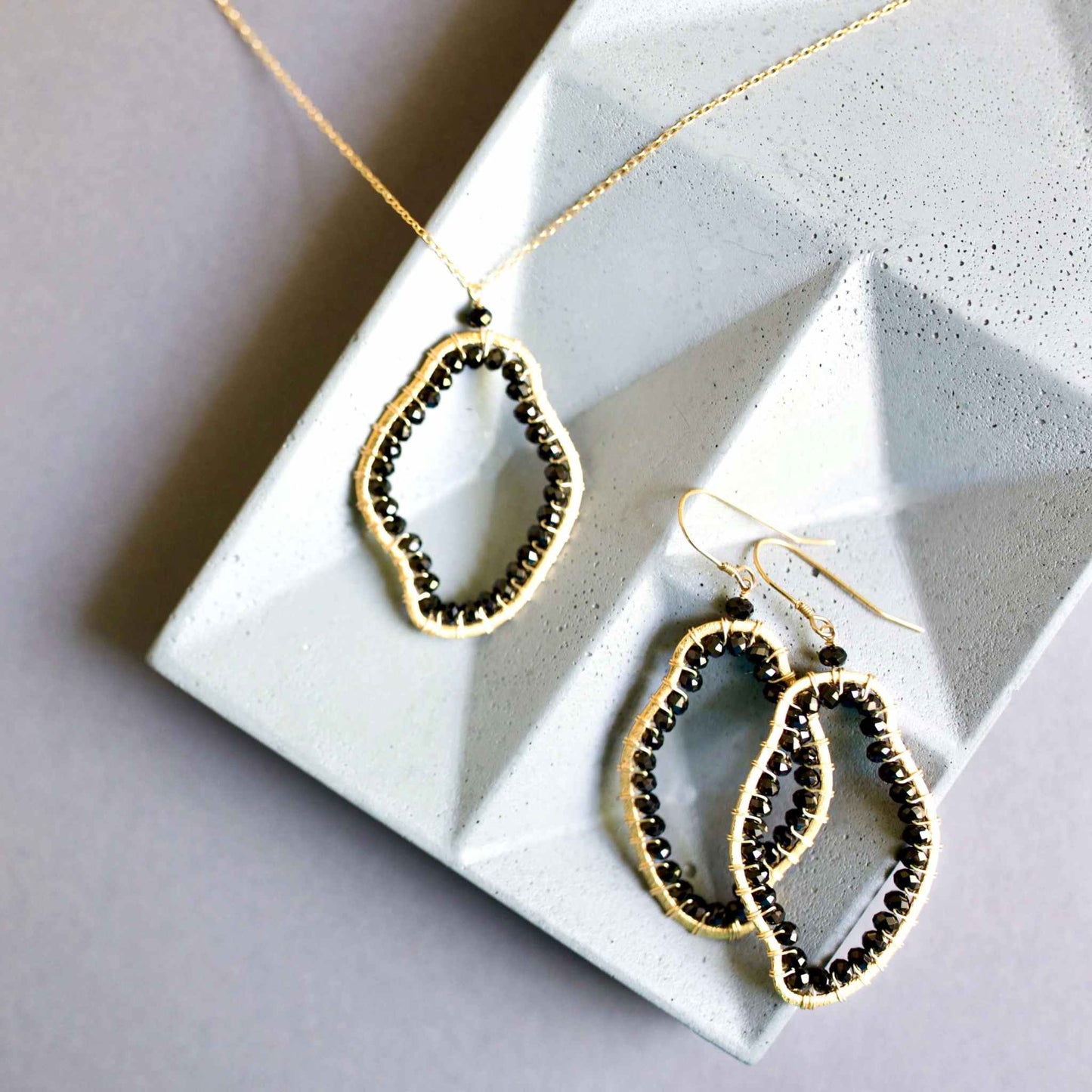 Black Spinel Freestyle Earrings with unique abstract shapes, 14k gold plated sterling silver, handmade in NYC, 2.5 inches long