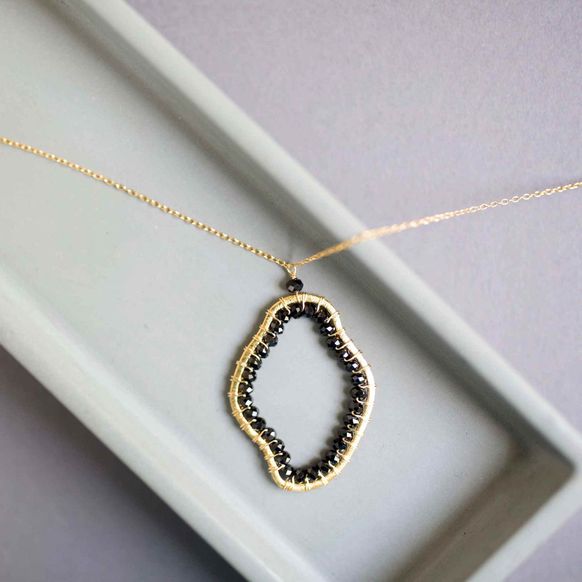 Black Spinel freestyle pendant necklace on delicate gold chain, unique abstract design, 14k gold plated sterling silver