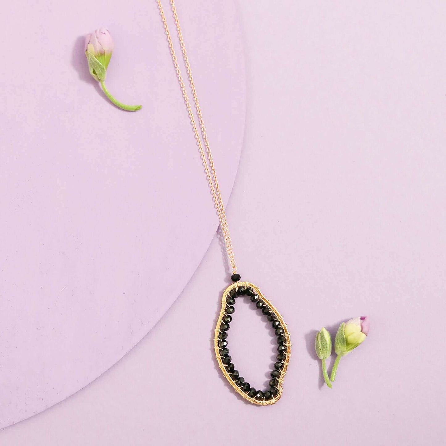 Black Spinel pendant necklace with unique abstract shape on delicate 14k gold plated sterling silver chain