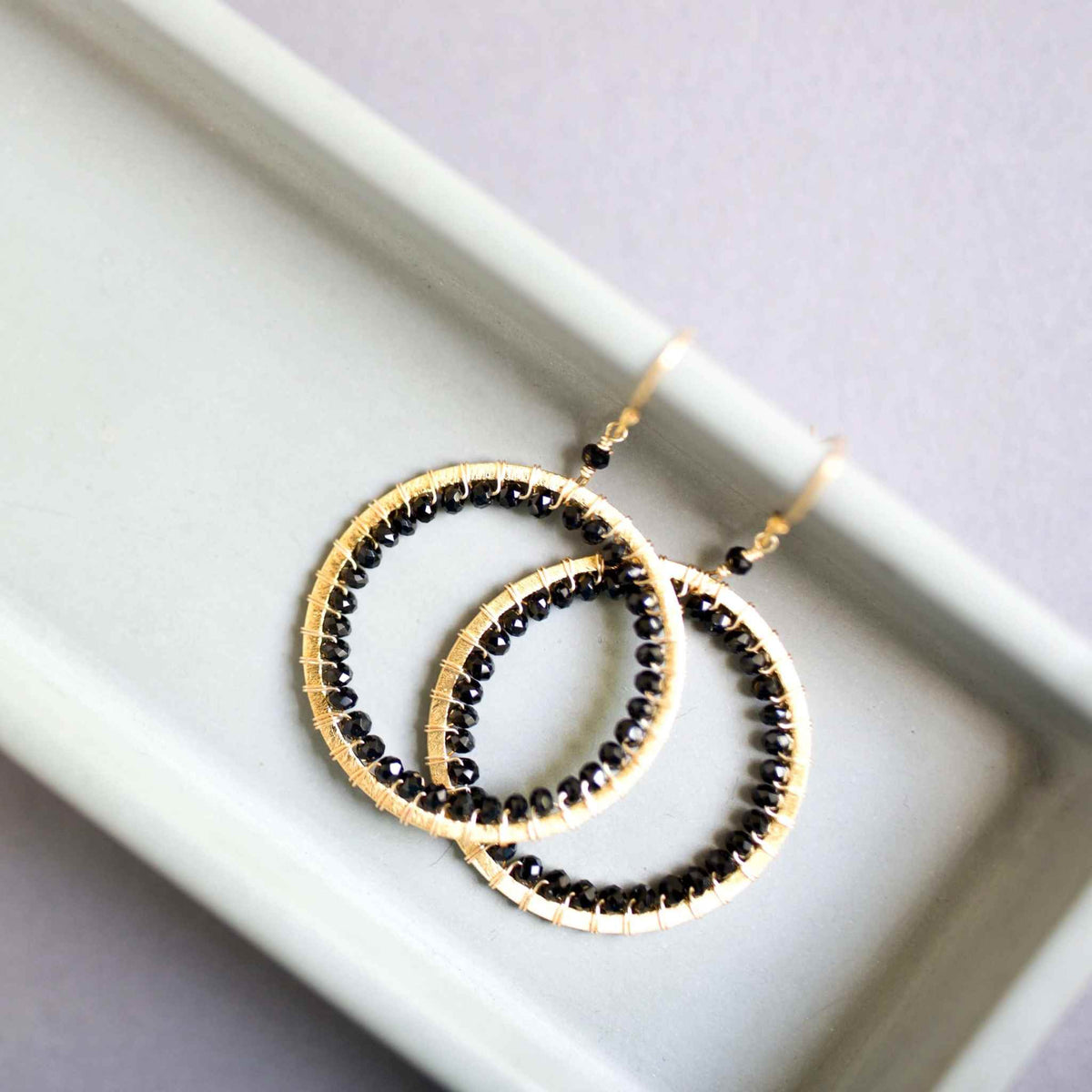 Elegant Black Spinel Halo Earrings with 14k gold plating and French hooks, handmade and lightweight.