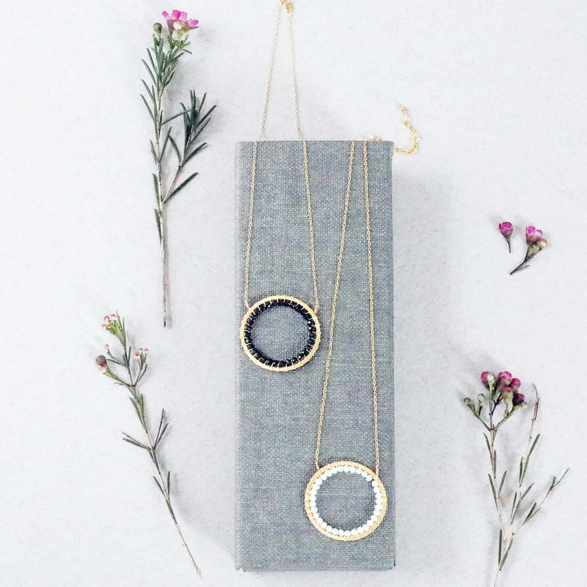 Black Spinel Halo Necklace with adjustable 14k gold plated silver chain and floating pendant design