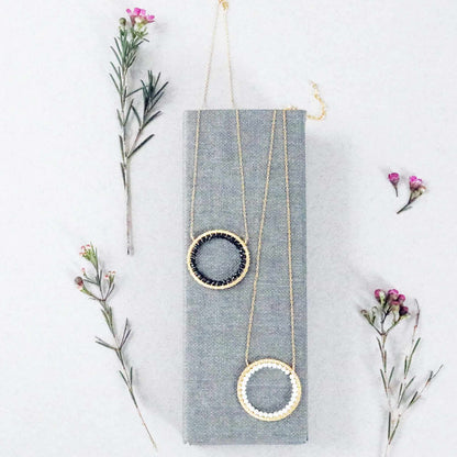 Black Spinel Halo Necklace with adjustable 14k gold plated silver chain and floating pendant design