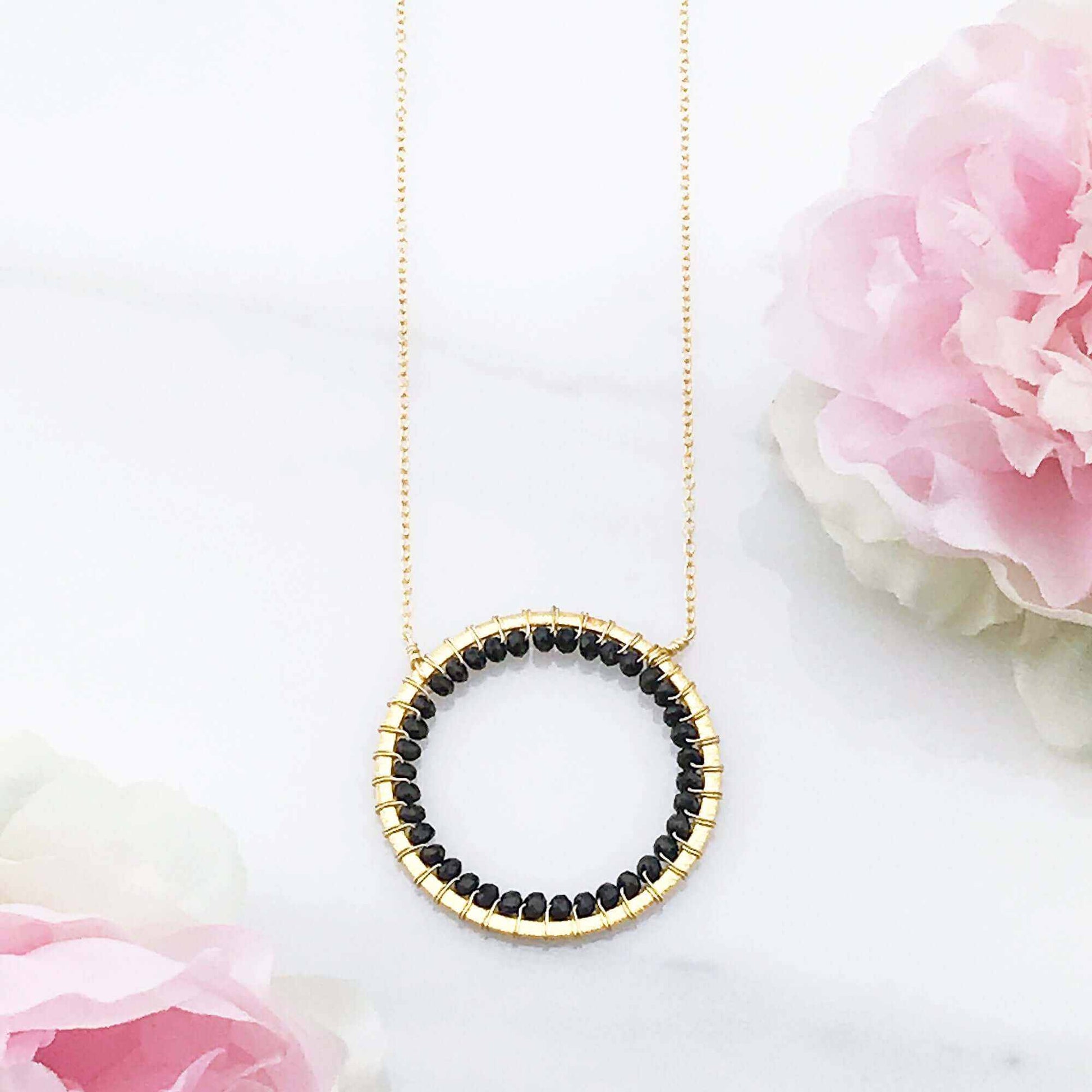 Black Spinel Halo Necklace with floating pendant and 14k gold plated adjustable chain
