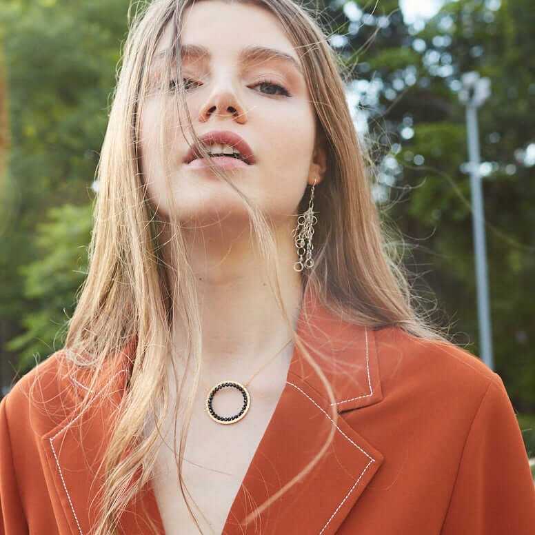 Black Spinel Halo Necklace with 14k gold plated sterling silver chain and floating pendant design