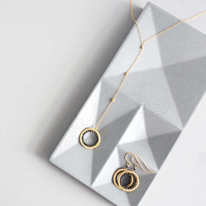 Black spinel pendant with rainbow gemstones and pearl on gold plated chain