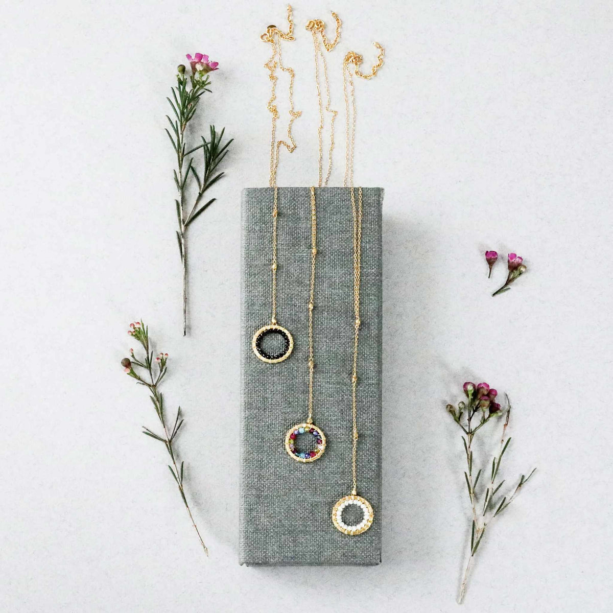 Black Spinel pendant with rainbow gemstones and pearl on gold plated silver chain