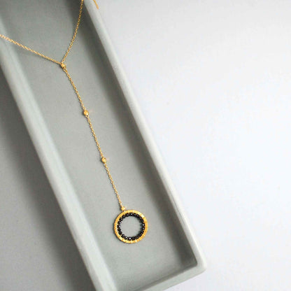 Black Spinel pendant with rainbow gemstones and pearl on a 14k gold plated Y necklace