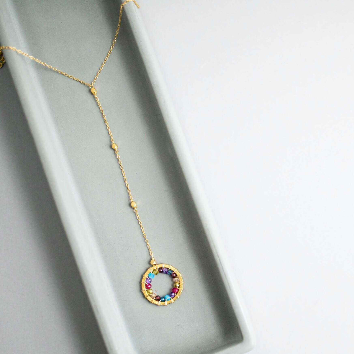 Black Spinel Y pendant necklace with rainbow gemstones and pearl halo on 14k gold plated sterling silver chain