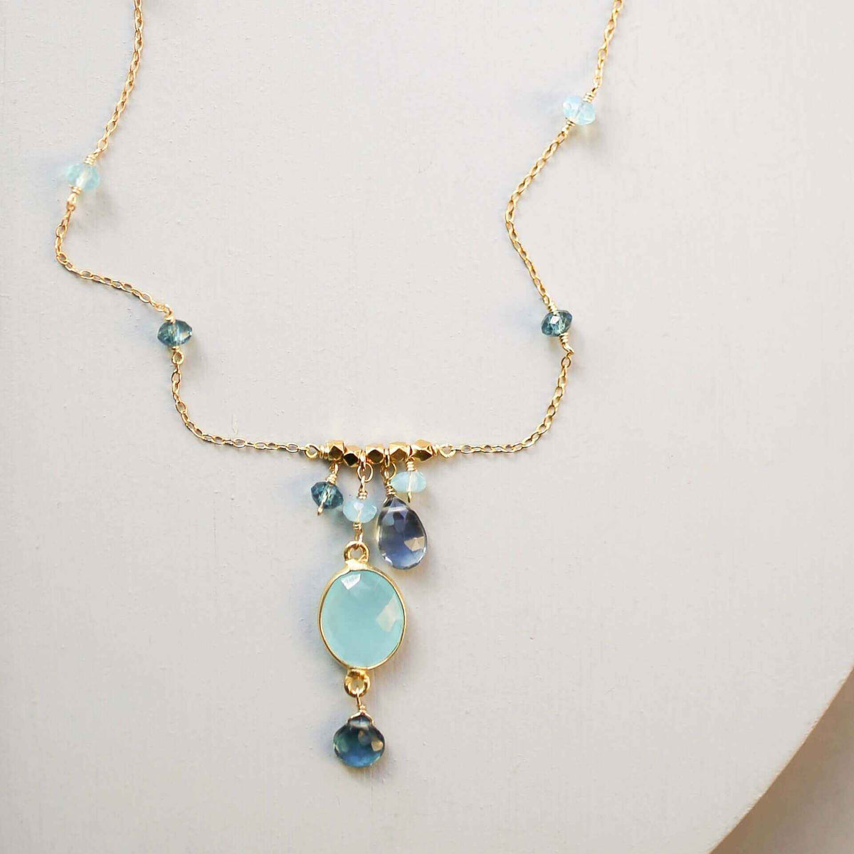 Blue Chalcedony Bezel Necklace on gold chain with iolite accents and adjustable length