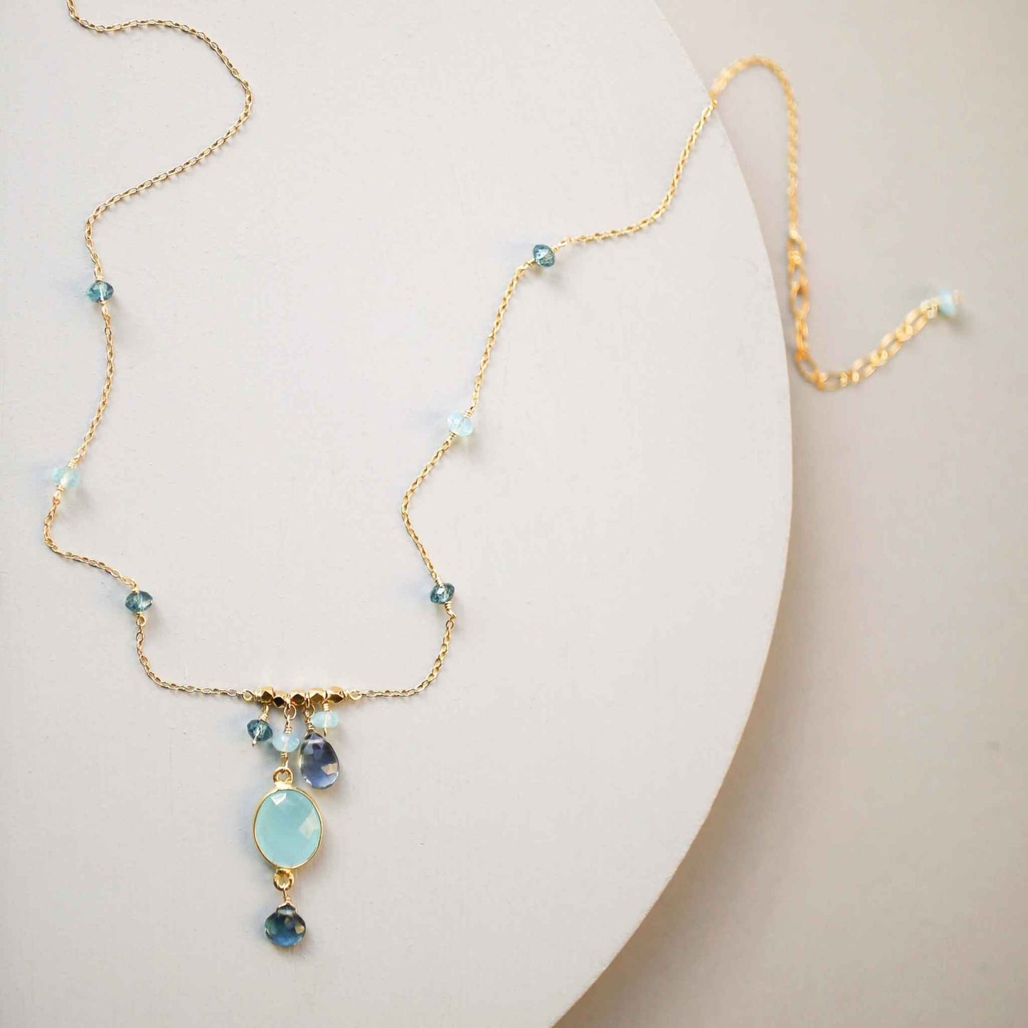 Blue chalcedony bezel necklace with gold chain and iolite accents, adjustable length, handmade in NYC