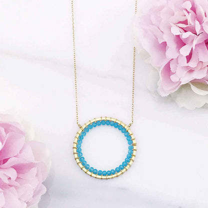 Blue Chalcedony Halo Necklace with 14k gold plated sterling silver chain and floating pendant design