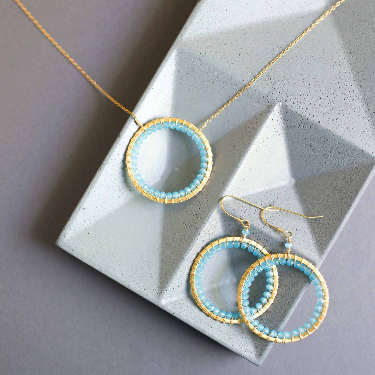 Blue Chalcedony Halo Necklace with 14k gold plated sterling silver chain and floating pendant design