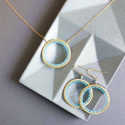 Blue Chalcedony Halo Necklace with 14k gold plated sterling silver chain and floating pendant design