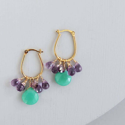Chrysoprase & Amethyst Gold EarringsWe loved the bright sea green color of chrysoprase gemstones the minute we set eyes on them. Paired with sparkling amethyst, and so lightweight you'll love wearing tEarringsPARKEN JEWELRYVettedArcChrysoprase & Amethyst