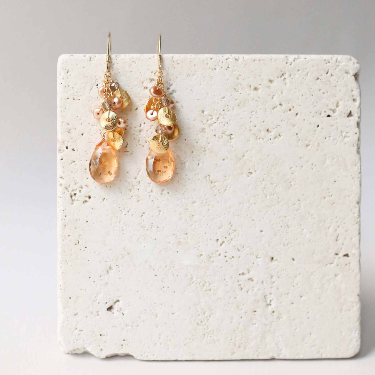 Citrine Aurora earrings with cascading citrine gemstones, pearls, and 14k gold plated sterling silver French hooks.