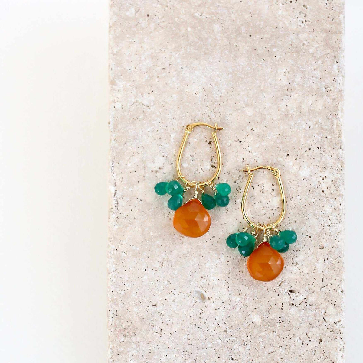 Dark Orange Chalcedony & Green Onyx Gold EarringsSmall but mighty rich color. Beautiful dark orange chalcedony paired with green onyx briolettes.
- 1.5 inches long- Latch backs- 14k gold plated .925 fine Italian stEarringsPARKEN JEWELRYVettedArcDark Orange Chalcedony