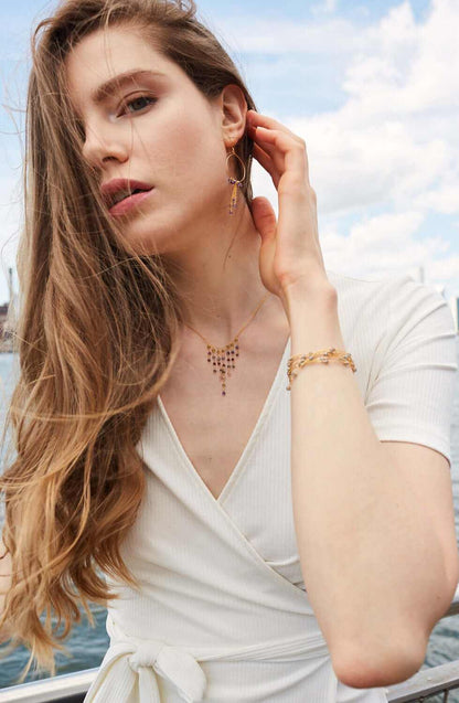 Delicate gold labradorite layering chain necklace with spring ring clasp on white background
