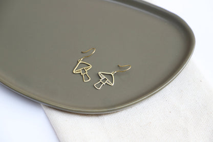 Gleaming Gold Dangle Earrings with Enchanting Mushroom Design