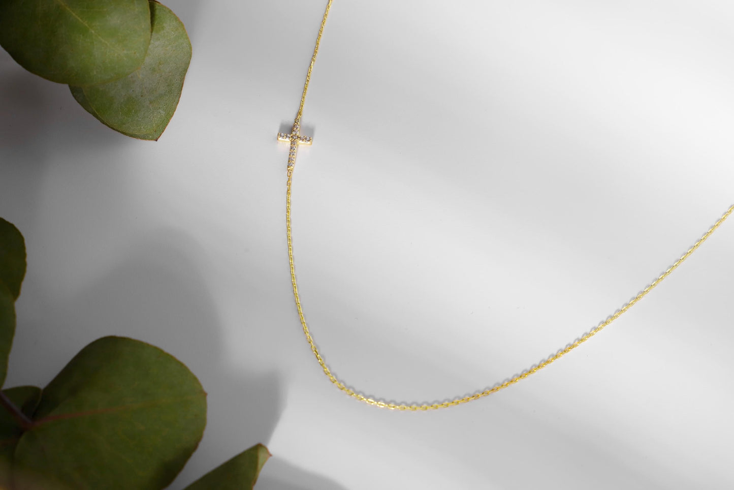 14K Gold Sideways Cross Necklace with Sparkling CZ Diamonds