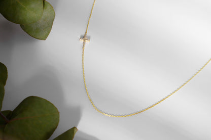 14K Gold Sideways Cross Necklace with Sparkling CZ Diamonds