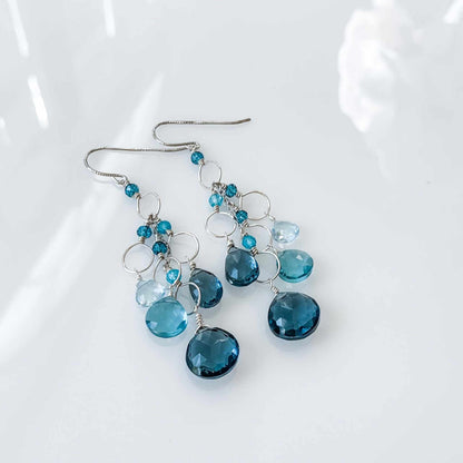 Iolite & Aquamarine Gold Waterfall EarringsElegant Iolite &amp; Aquamarine Gold Waterfall Earrings feature a unique tiered chandelier earring design, set in 14k gold plated over fine .925 Italian sterling silEarringsPARKEN JEWELRYVettedArcIolite & Aquamarine