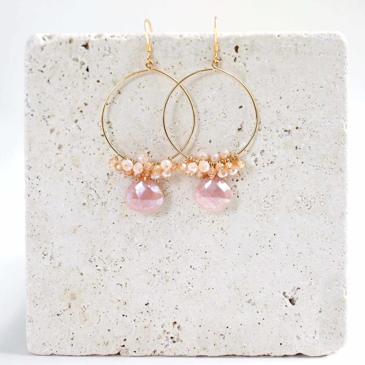 Close-up of Peach Moonstone Swing Earrings with 14k gold plated lightweight hoops and French hooks